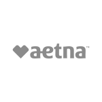 Transparent image of the Aetna logo, displaying the company name 'aetna' in lowercase, sans-serif font, with a solid heart shape to the left, all against a checkered background signifying the transparency of the image.